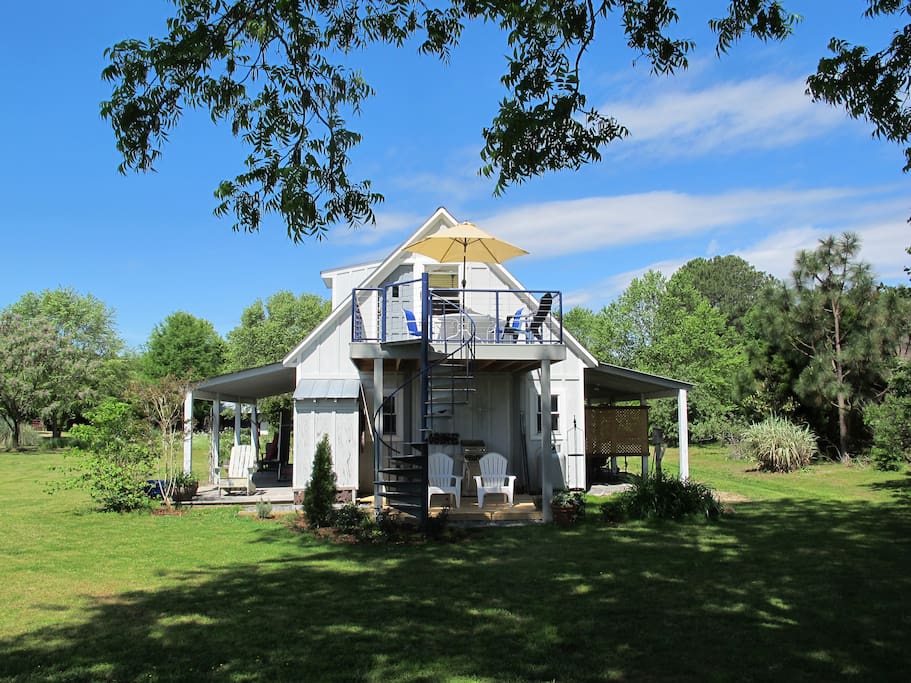 View from the water side. Unit includes the upper and lower decks. Enjoy the sun up top and the shade underneath, all while soaking in views of the water!