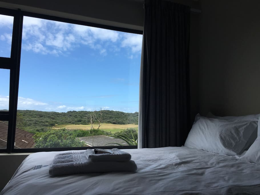 Bed with a view of the golf course