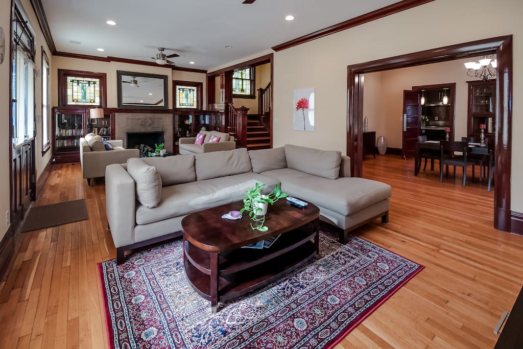 Spacious living room with 2 separate seating areas, plenty of natural light from south facing front of the house