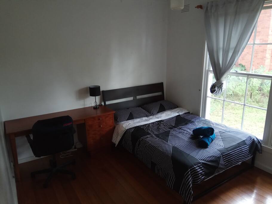 Double size bed with study desk and chairs