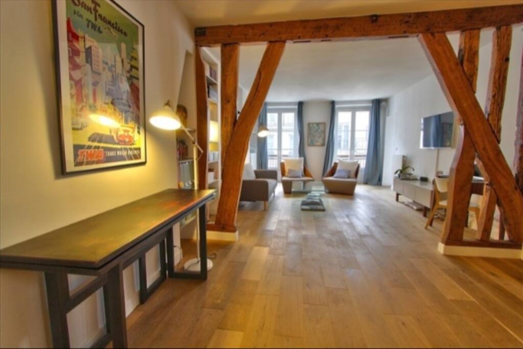 big living room with convertible sofa and designer furnitures