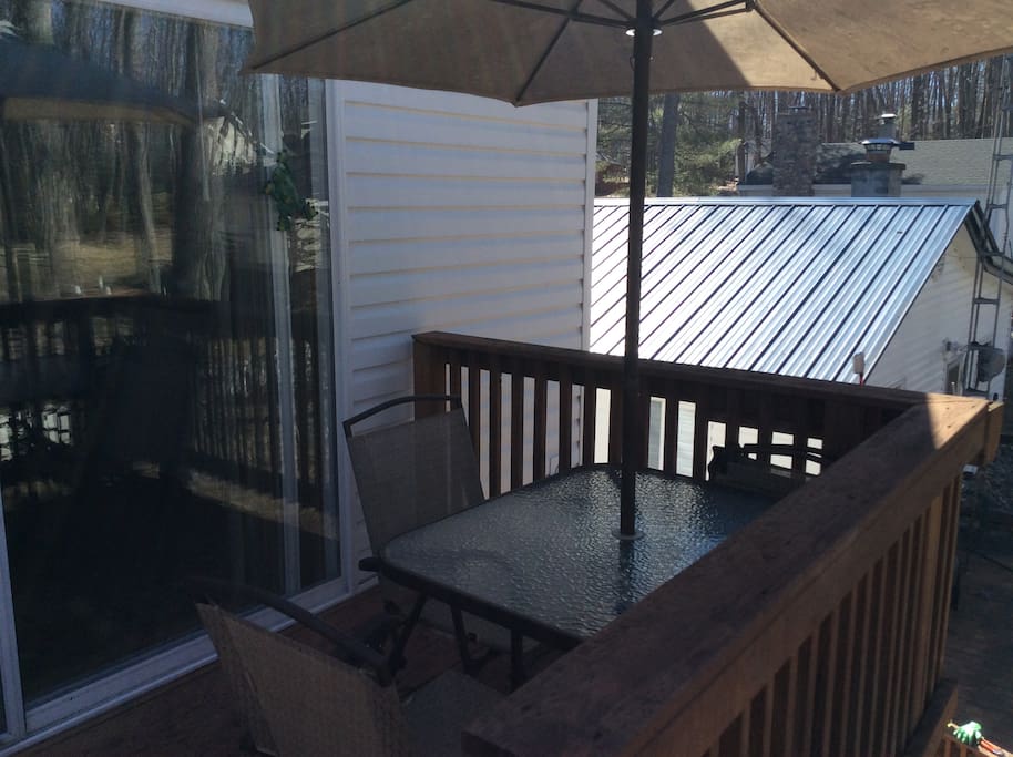 The deck/sliding glass door entry way at the top of the stairs