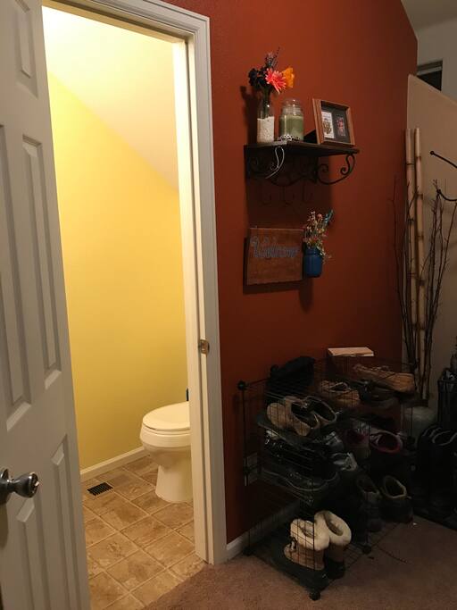 The half bath is under the stairs to use up some negative space that would otherwise not get used except for maybe a coat closet.