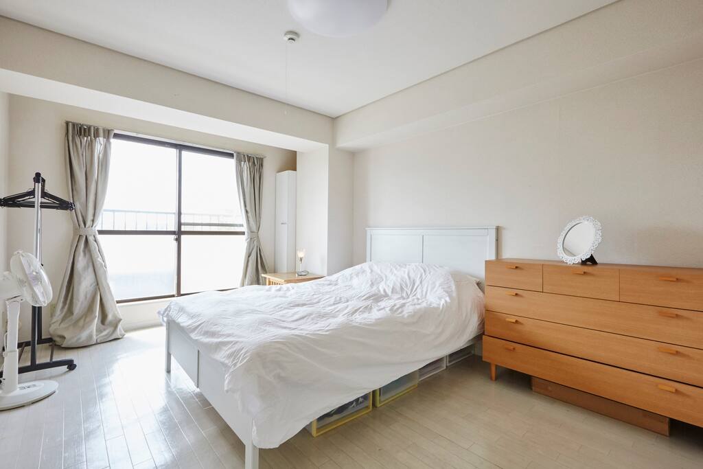 Spacious and sunny bedroom with queen size bed and ample closet and dresser space.