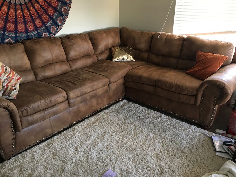 This is the sectional couch you can use! Two people can sleep on this couch. It is not a hide a bed but it’s very comfy.
