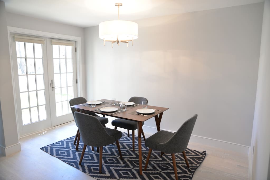dining room that opens to deck and exclusive use yard