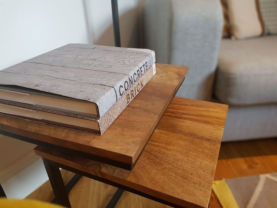 Side tables and books in the lounge area