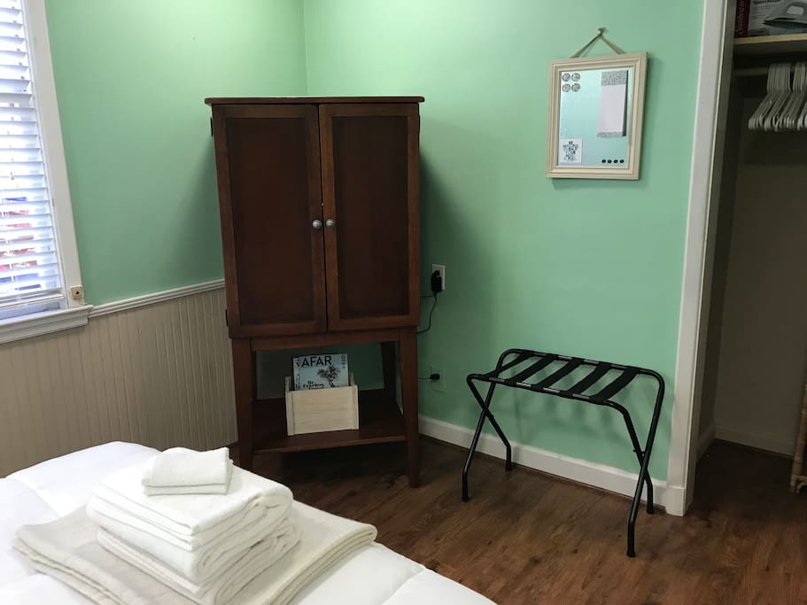 Armoire with TV, Roku and bluetooth speaker. Closet and luggage rack. White noise machine.