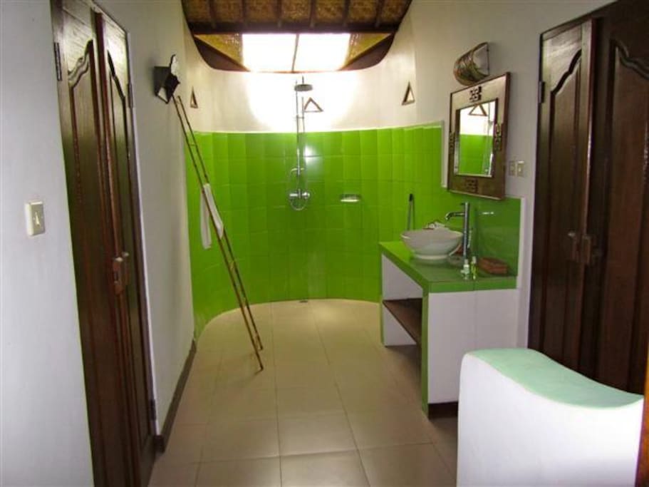 Queen bed, bedroom and bathroom in a shared home.