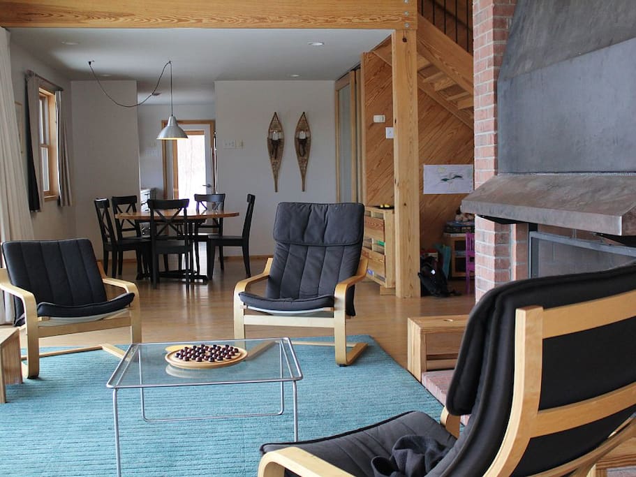 The living room provides comfortable seating and a fireplace