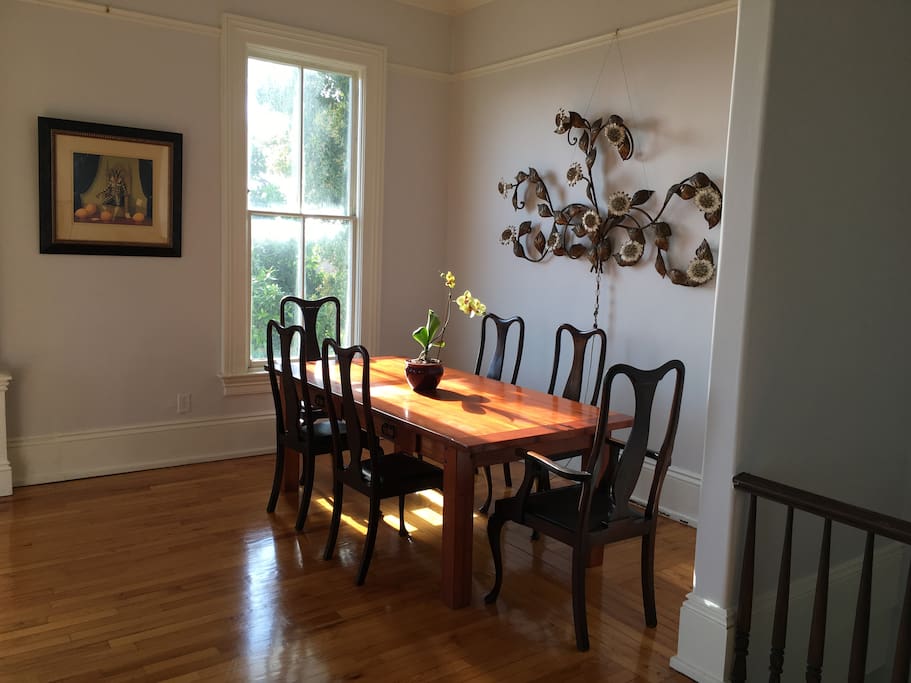 Living room with antique Italian wall sconce and dinning table for 8.