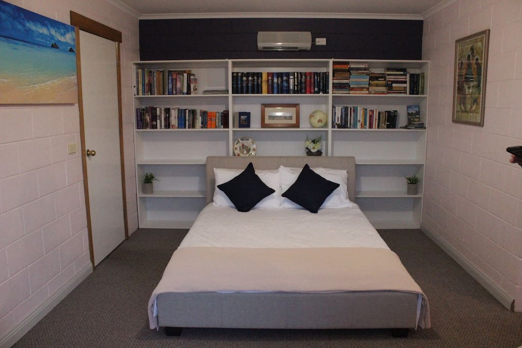 The bedroom with a queen size bed.