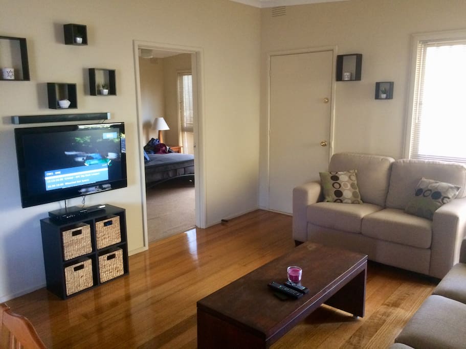 Main lounge and dinning room combined. Wall mounted flat screen tv, Bluetooth speaker, Spilt system cooling and electric heater