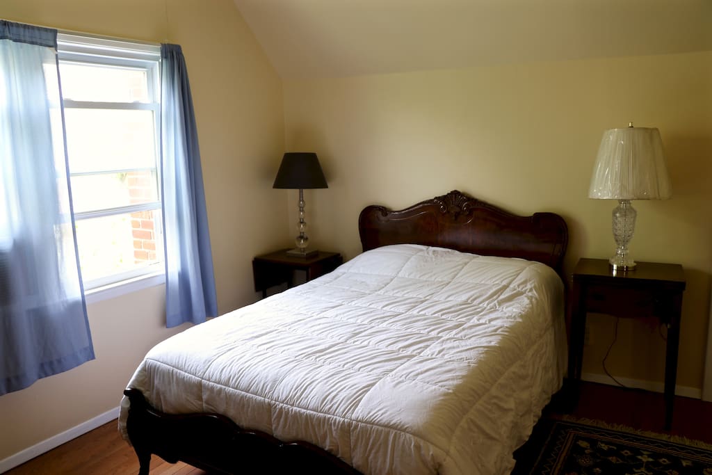 private guest bedroom #1 (one full-sized bed, mirror, closet, A/C and chairs)
