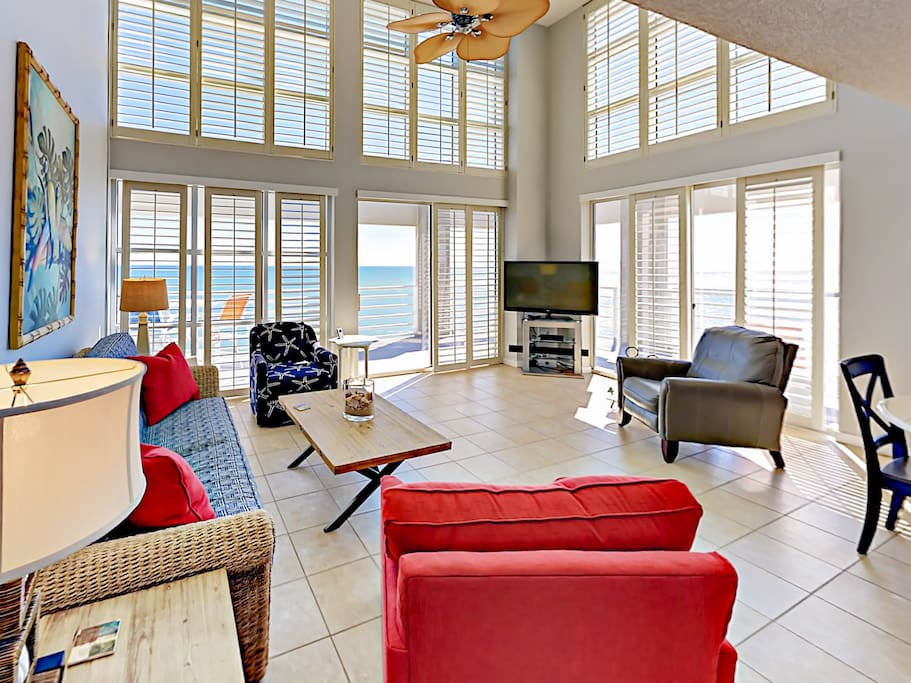Bright, airy, and spacious living area - where floor-to-ceiling windows fill the space with sunlight.