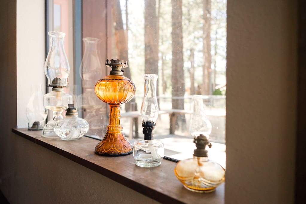 Antique oil lamps add to the rustic feel of the house