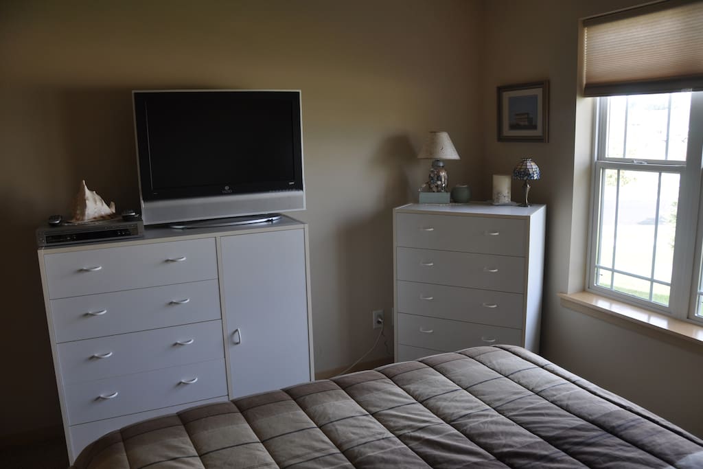 Dresser space and closet space for your use. Fresh linens with towels. No TV channels on this TV, but plenty of movies to watch in your bedroom.