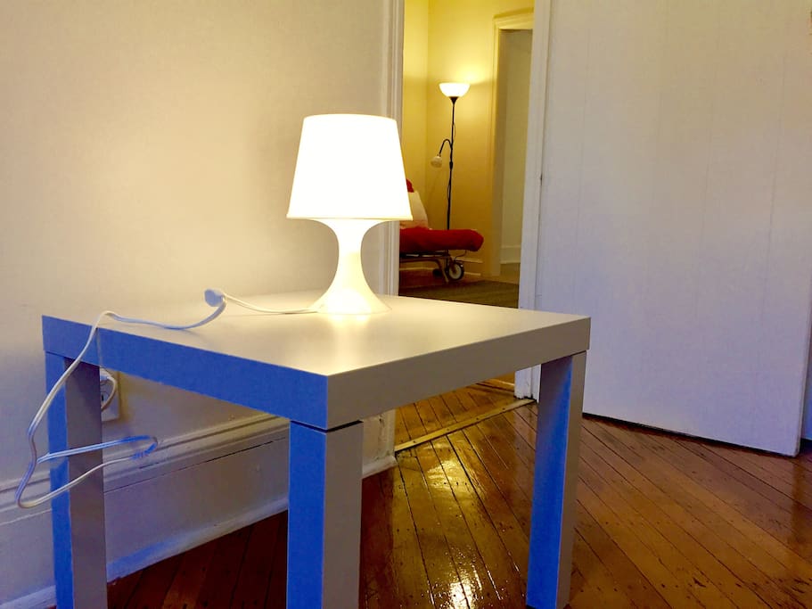 lamp and side table in small bedroom