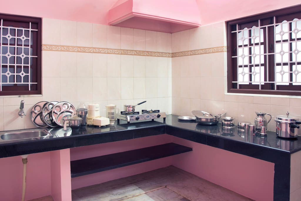 KITCHEN with mixcy,cooking vessels,plates,cooker,gas stove