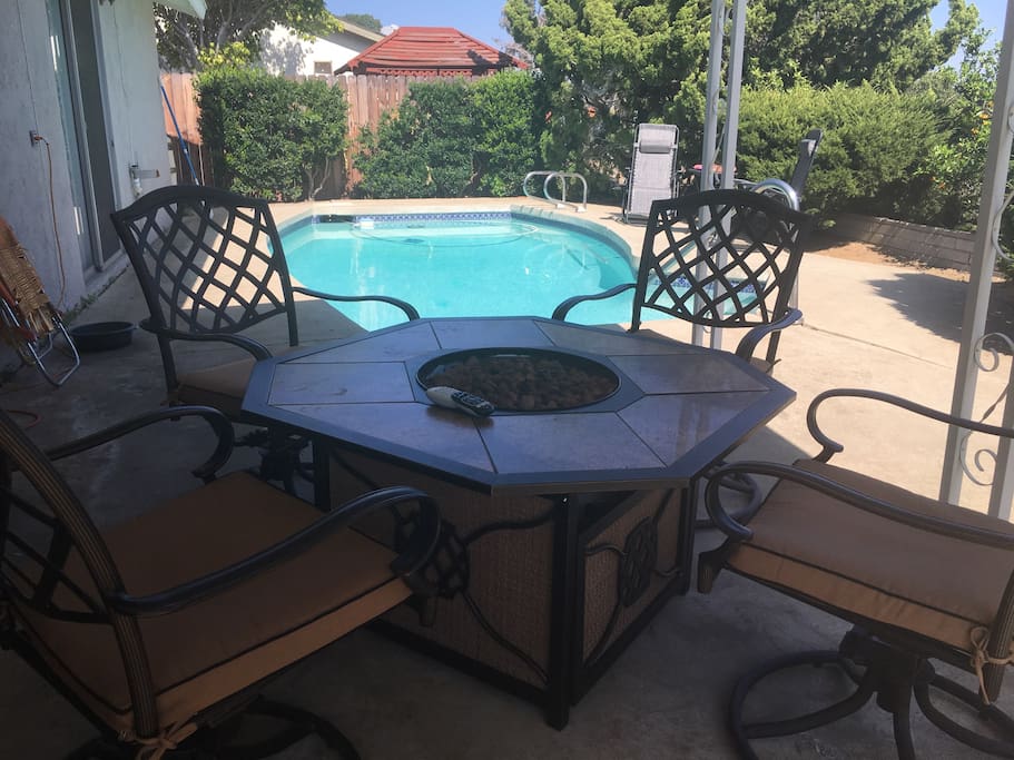Fire pit patio table perfect for dining or lounging, 37" TV facing patio.