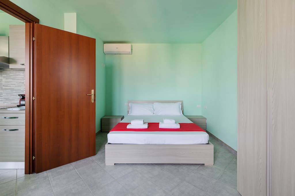 The Bedroom - The comfortable double bed with soft bed-linen and towels
