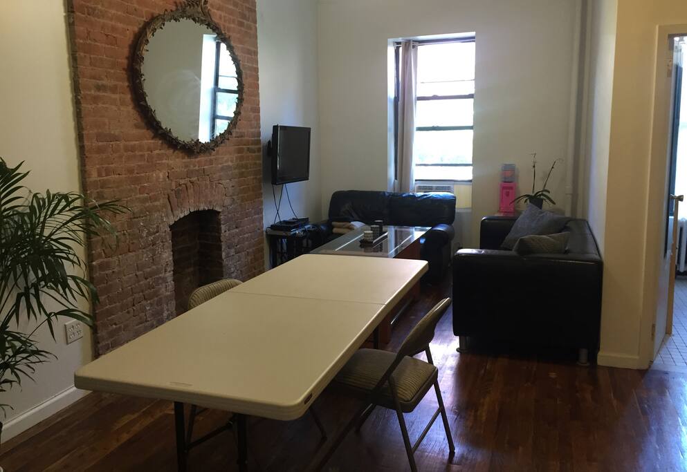 Living room with folding table that can fit up to 12 people
