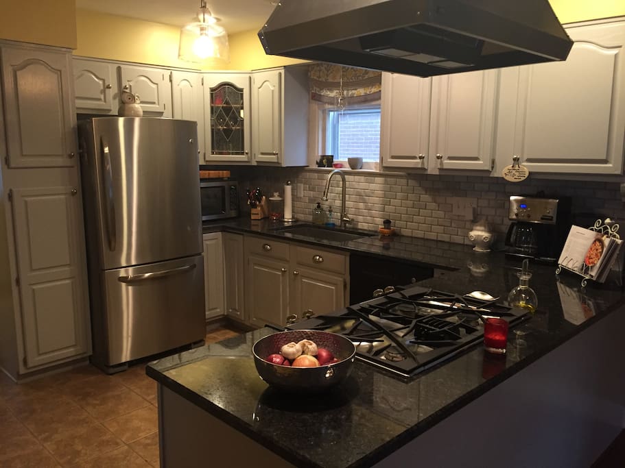 Kitchen with granite counter tops and updated appliances