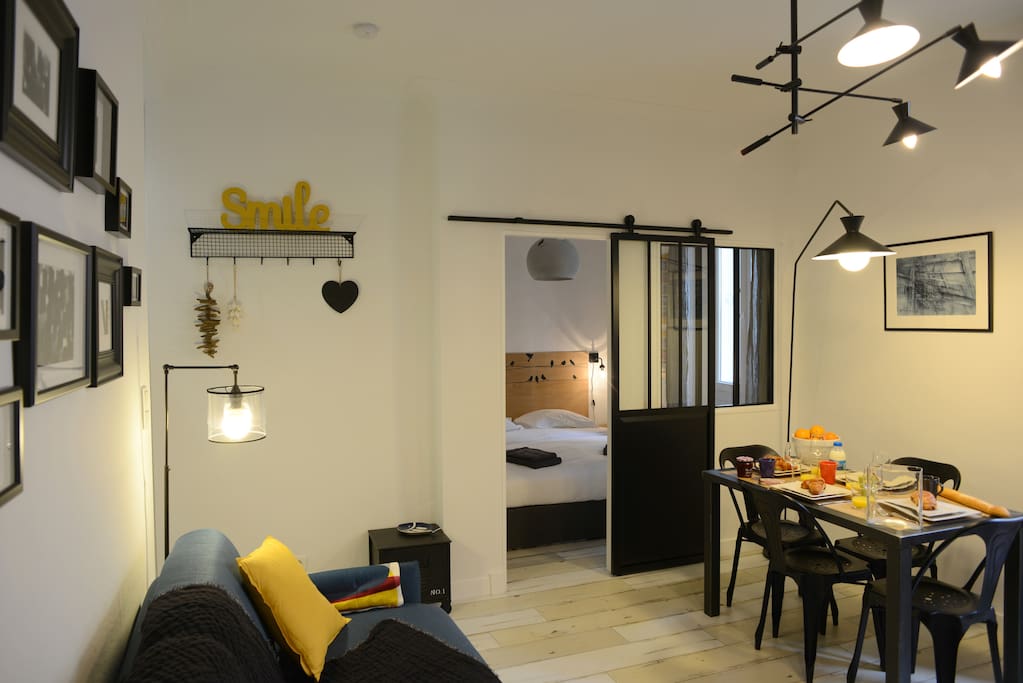 View over the sitting-room, dining-room and bedroom (separated by a door)