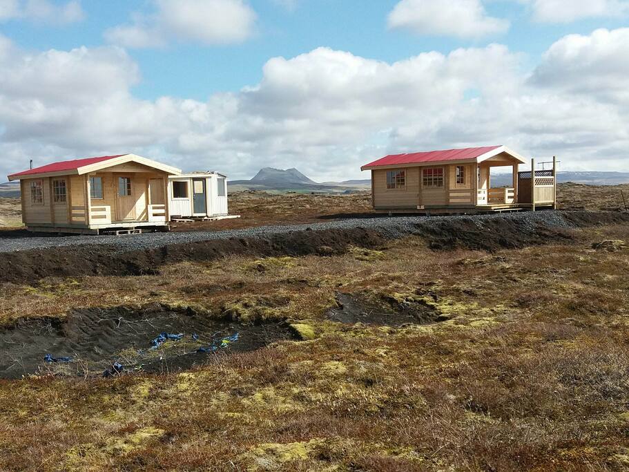 Hemlulundur 1, Hemlulundur 2 and the kitchen/toilet facility cabin behind the cabins.