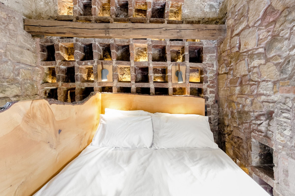 Ancient nesting boxes behind bed