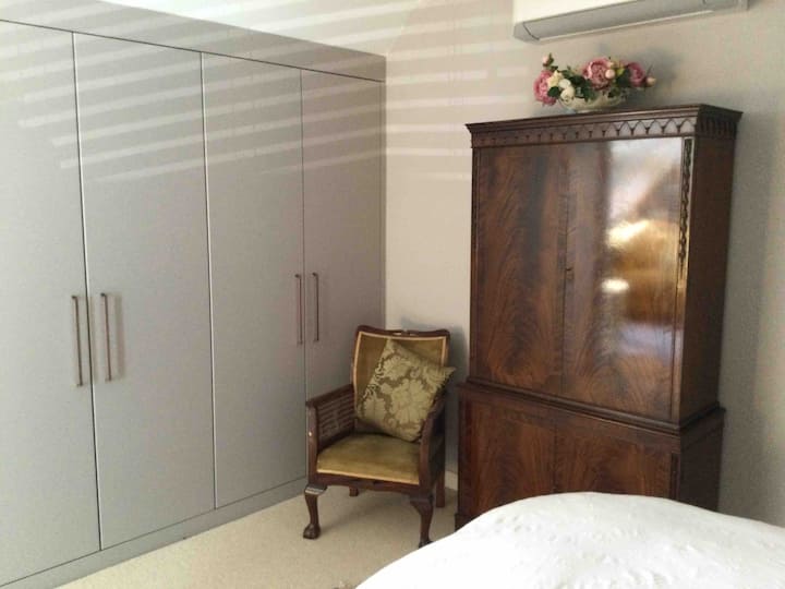 Plenty of hanging storage in the bedroom as well as built in chest of drawers.