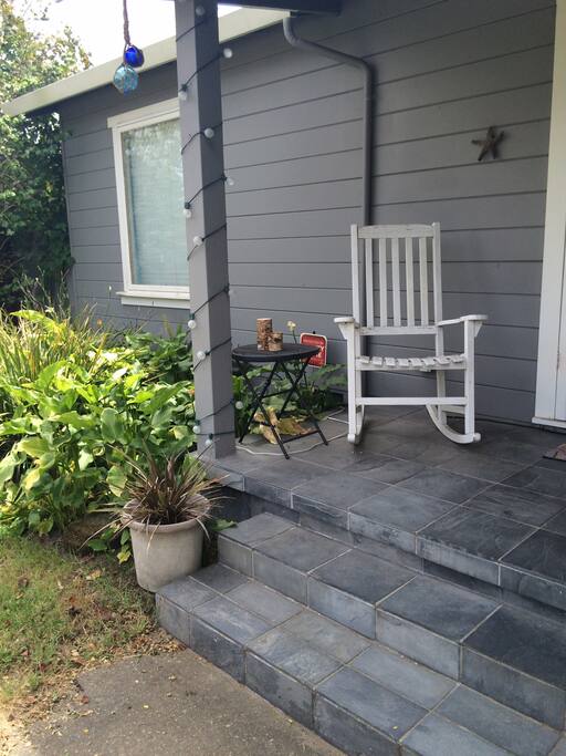 Front porch to chill on with timed lights.