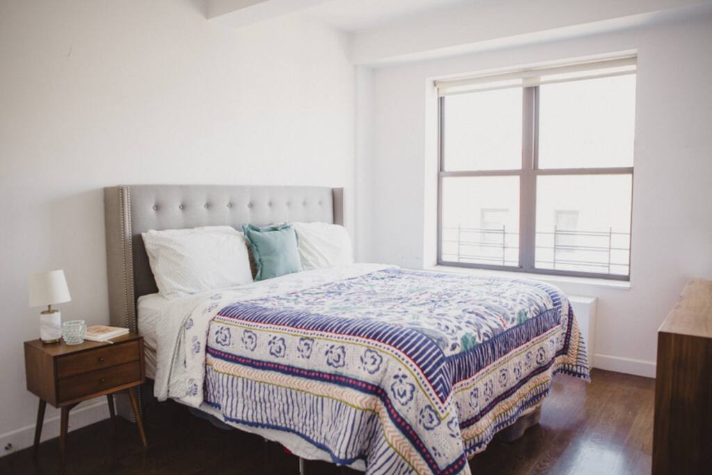 Large bedroom has a Cal-King comfy pillow-top bed and large window.