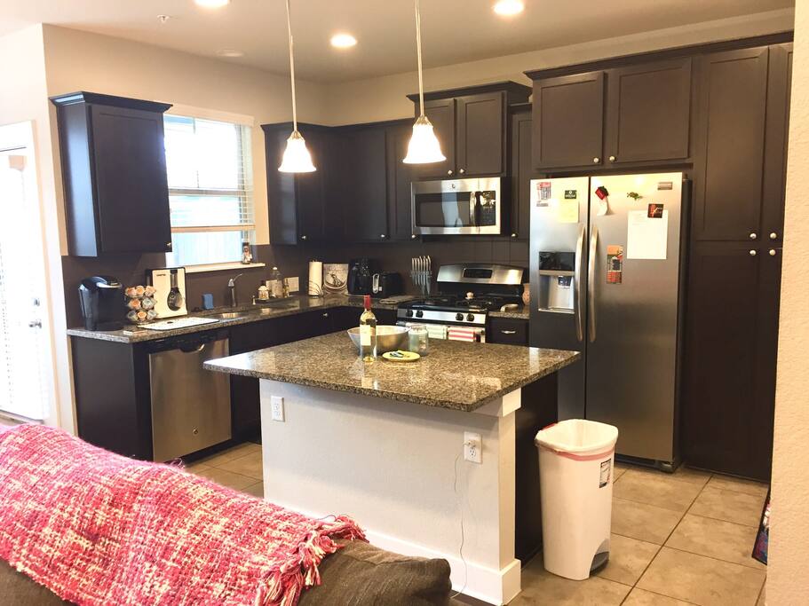 Full Kitchen with utensils, cookware, and appliances.
