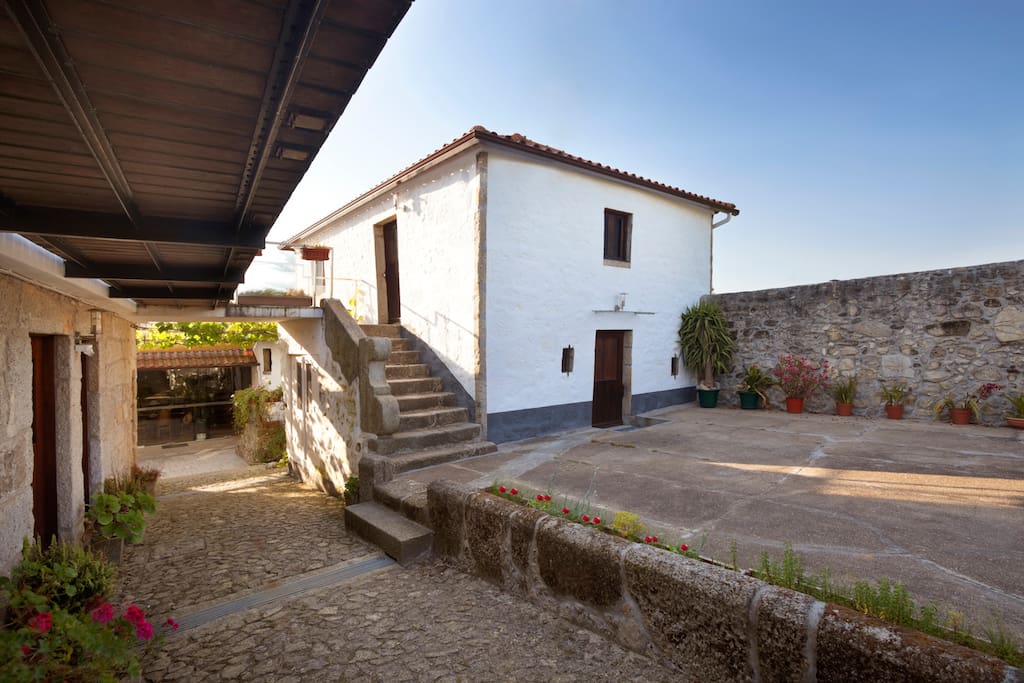 The old threshing floor and the access to the inner patio. Suite #1 is the complete top floor of the white building.