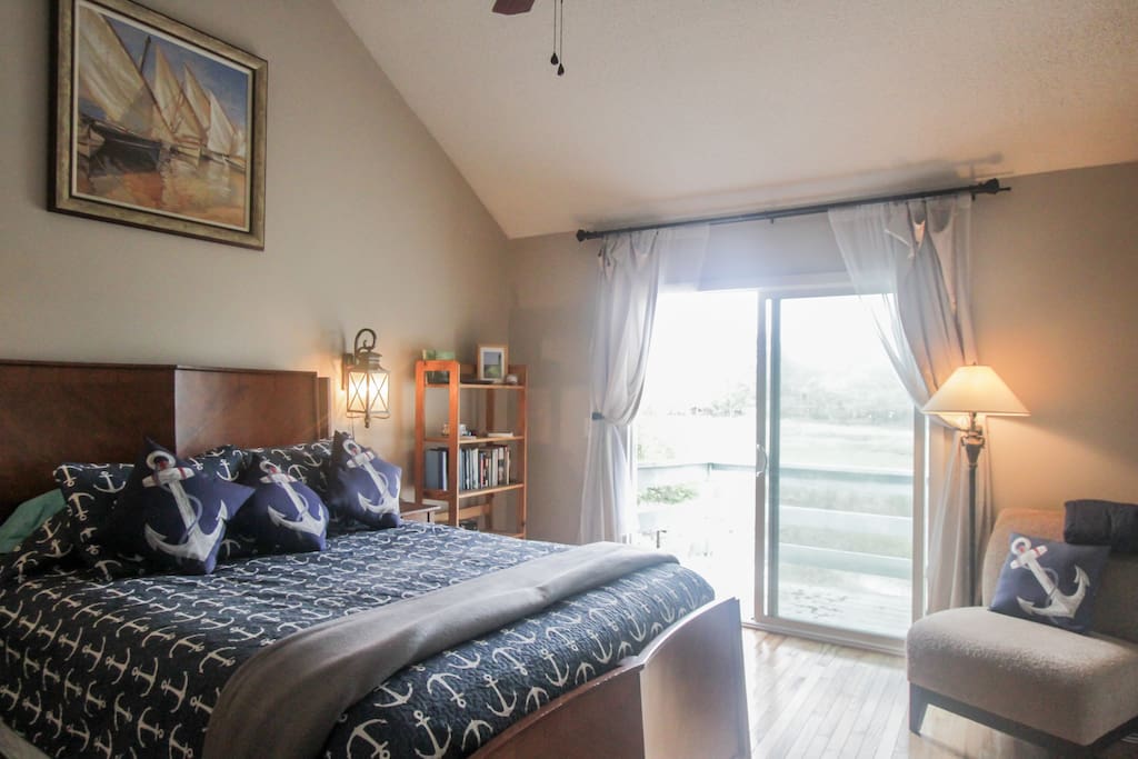 Master bedroom - queen bed and balcony overlooking the marsh