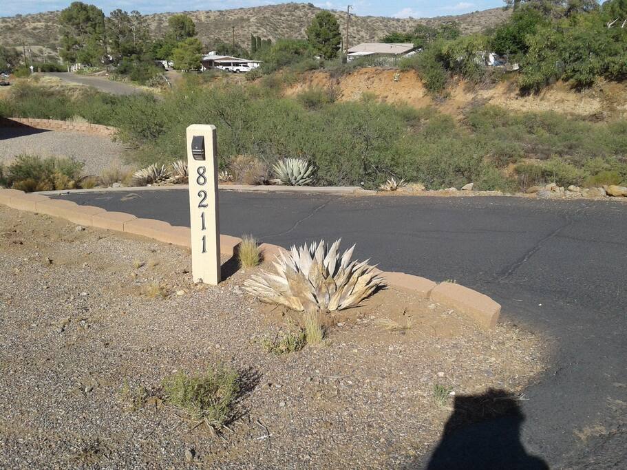Address sign at the driveway entrance.