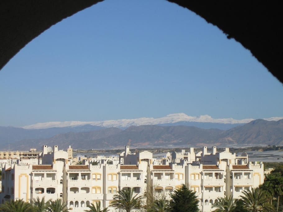 View of snow capped Sierra Nevada mountains from terrace