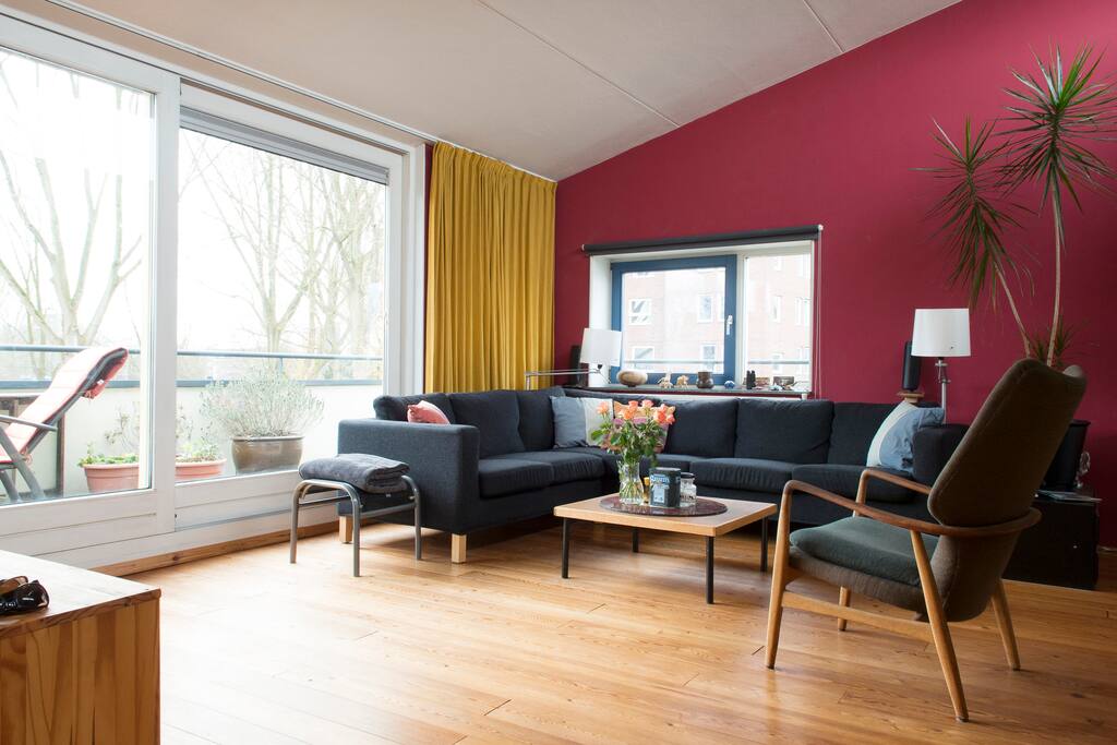 The living room with the nice wooden floor.