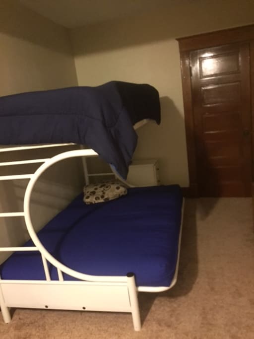 Twin over full, futon bunk bed for additional sleeping. Located in small area off living room.