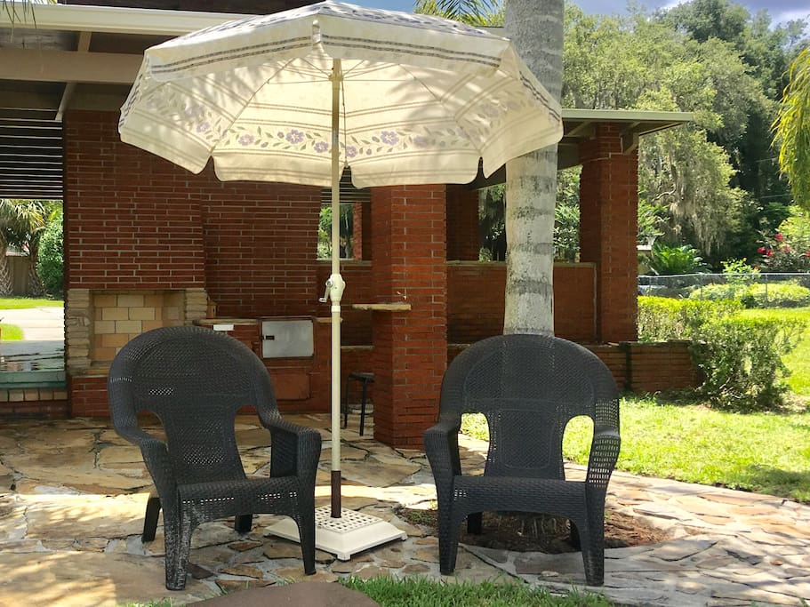 Covered carport in the background and barbecue