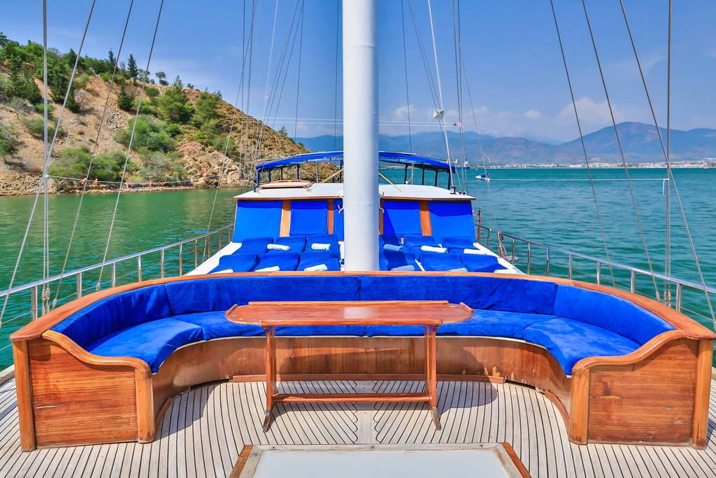 Forward of the sun loungers, a comfortable seating area provides an ideal spot for a relaxing drink
