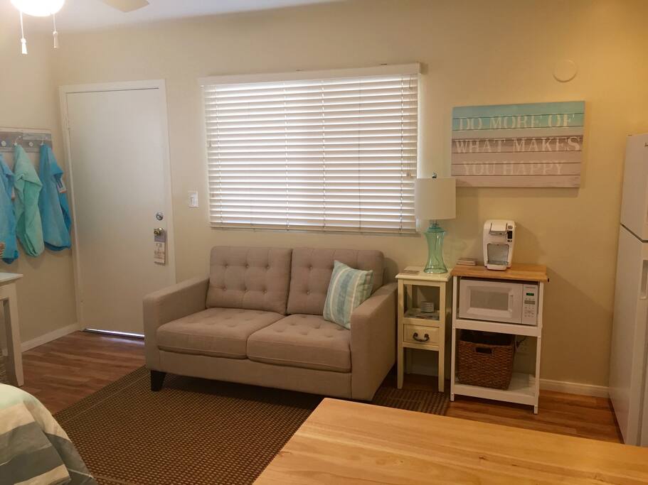 Coffee maker, microwave and sofa