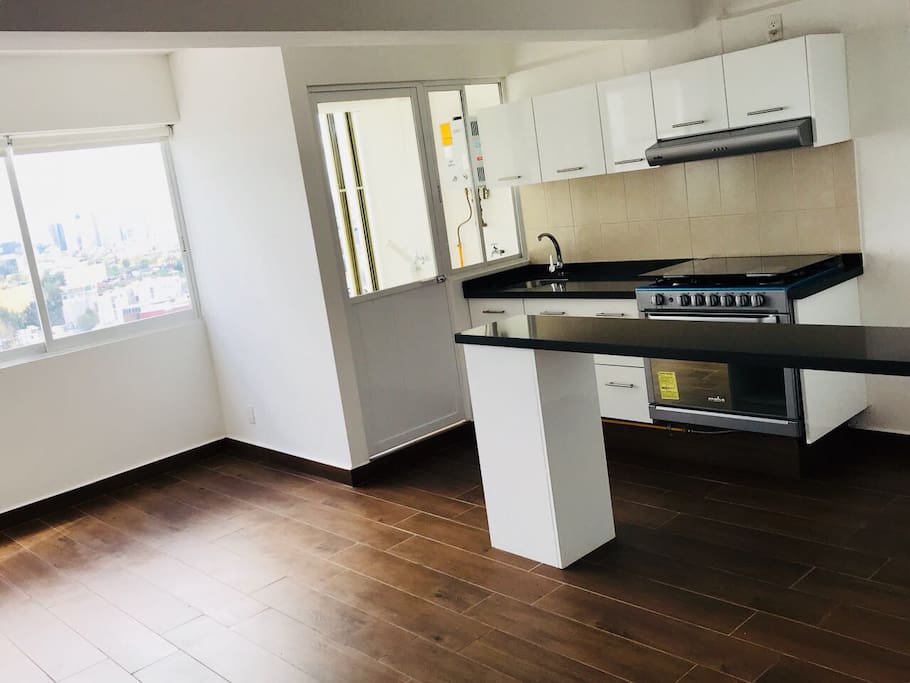 kitchen Equipment with fridge, micro, stove, coffee machine