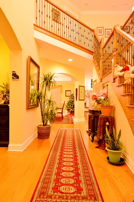 Hall way and stairs that lead three bedrooms upstairs.