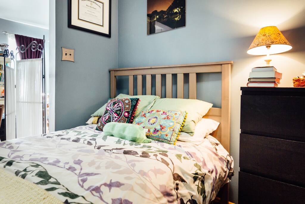 open bedroom space that connects to living room, privacy screen if more than 2 guests are staying