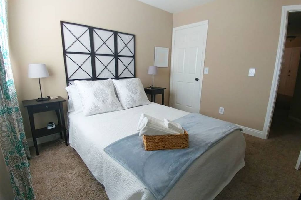 Relaxing queen bedroom, spacious walk-in in closet with shelves and hangers