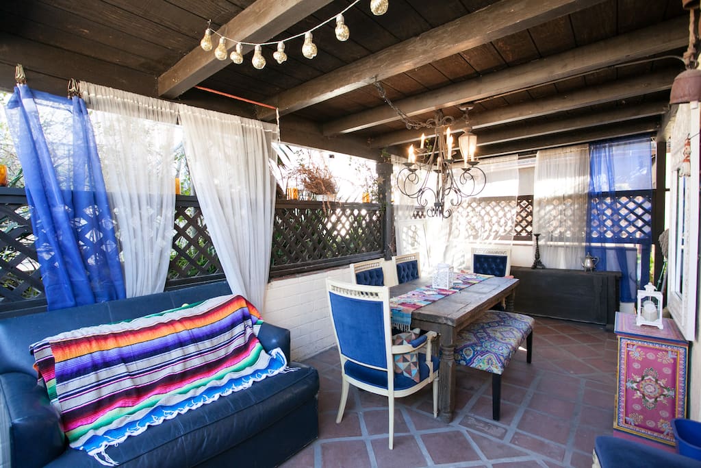 The amazing outdoor living room with a pull out couch that could be used for sleeping if you are the type of person that gets excited about sleeping outdoors.