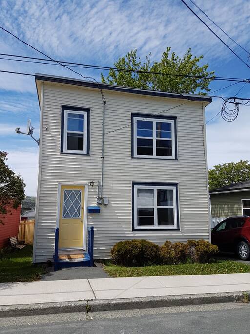 Traditional salt box house with parking.