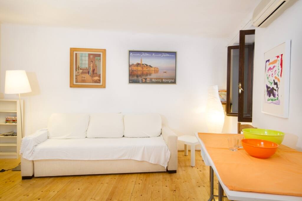 living room with a sofa bed for two people